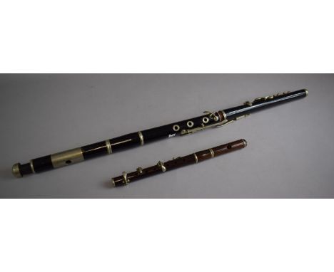 A Vintage Ebonised Irish Flute with Nickel Mounts and a Rosewood Piccolo with Nickel Mounts. Both in Need of Attention 