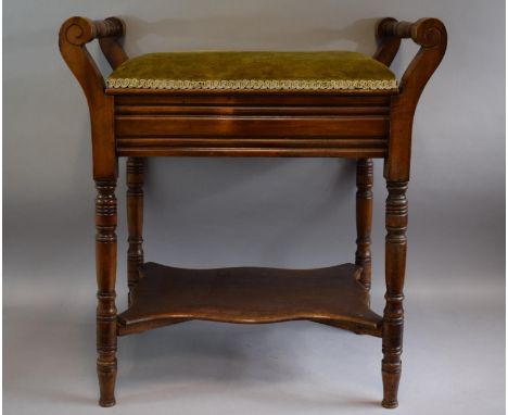 An Edwardian Mahogany Piano Stool With Upholstered Hinged Seat, Turned Carrying Handles and Stretcher Shelf 