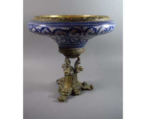 A Reproduction French Style Ormolu and Crackle Glazed Blue and White Ceramic Table Centre with Dolphin Supports and Three Scr