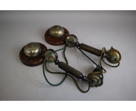 A Pair of Vintage Wall Mounting Bakelite Telephone Hand Sets and Bells on Circular Wooden Wall Mounts 