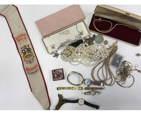 A box of costume jewellery together with a Salford Unity sash.