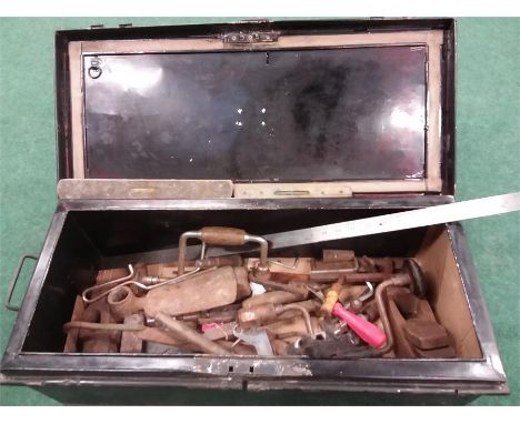 A metal toolbox and assorted tools.