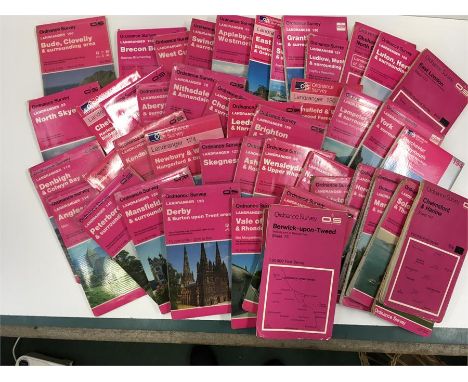 A box of Ordnance survey maps.