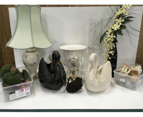 A box of various items to include ceramic swans, table lamp,candle holder, an anniversary clock and other ornaments.