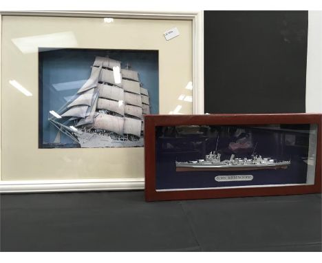 A decoupage picture of a yacht together with a model of the H.M.S. Birmingham in case.