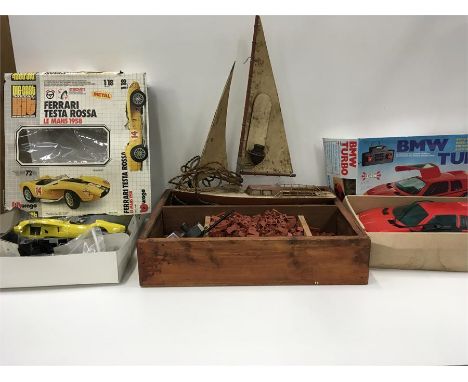 Two kit built cars, a wooden box of Minibrix together with a tin plate model lamp of a yacht.