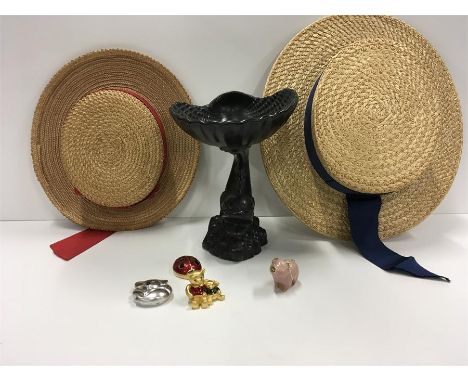 Two straw children's boaters, a ceramic centre piece and perfumes.