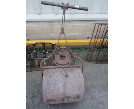 A cast iron garden roller by Barford Perkins.