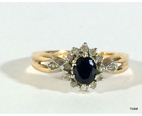 9 carat gold ladies' diamond and sapphire ring, size M.