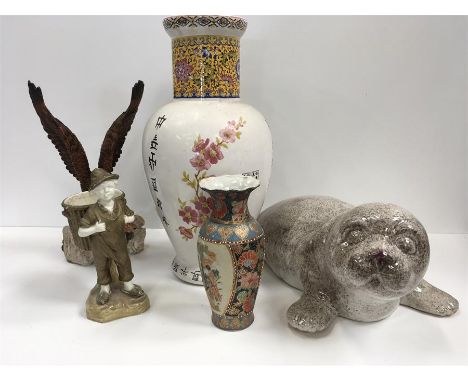 Two oriental vases, ornaments and a large ceramic seal.