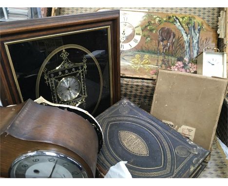 A wood bound trunk containing a bible, and clocks (af).