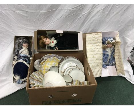 Three porcelain dolls and a box containing the residue of various tea/dinner services to include Midwinter.