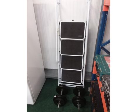 A four tread safety step with handrails together with a pair of dumbbells.