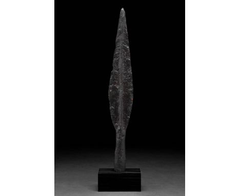 Ca. 100–300 AD. Roman. An iron spearhead with an elongated leaf-shaped blade, raised midrib, sharp tapering edges, and a long