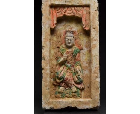 Ca. 386–534/535 AD. Northern Wei Dynasty. A terracotta tile featuring a beautiful depiction of a seated Buddha wearing garmen