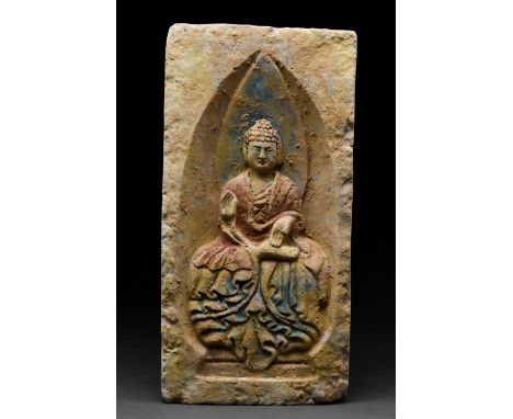 Ca. 386–534 AD. Northern Wei Dynasty. A rectangular ceramic brick featuring a seated Buddha with a plump face, elegantly curv