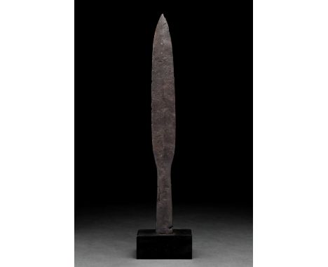 Ca. 100–300 AD. Roman. An iron spearhead with an elongated leaf-shaped blade, raised midrib, sharp tapering edges, and a long