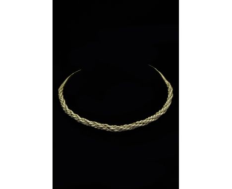 Ca. 900–1000 AD. Viking Age. A beautiful twisted silver torc made by interweaving four circular hoops coming together at the 