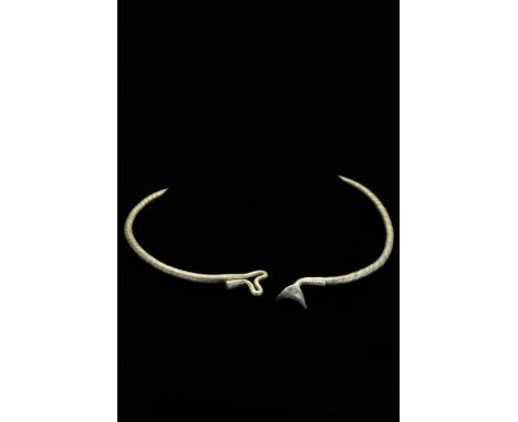 Ca. 700–900 AD. Viking. A beautiful, solid silver neck torc. The torc has a twisted rope-like effect on the body and punched-