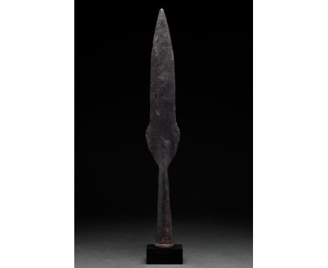 Ca. 800–1110 AD. Viking Age. An iron spearhead with a lanceolate blade with shoulders that flare before tapering to a pointed