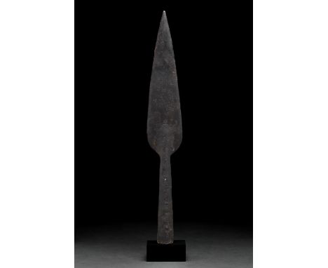 Ca. 100–300 AD. Roman. An iron spearhead with an elongated leaf-shaped blade, sharp tapering edges, and a long flared socket.