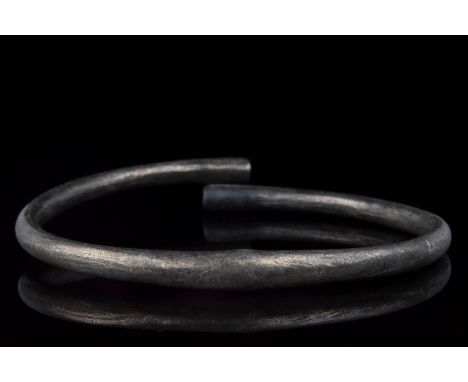 Ca. 900–1100 AD. Viking Age. A fine silver, coiled bracelet with overlapping terminals. In Viking society, arm rings and brac