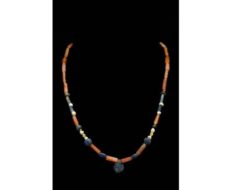 Ca. 100–300 AD. Roman. A beautiful restrung necklace comprising an upper panel made of tubular carnelian beads spaced by smal