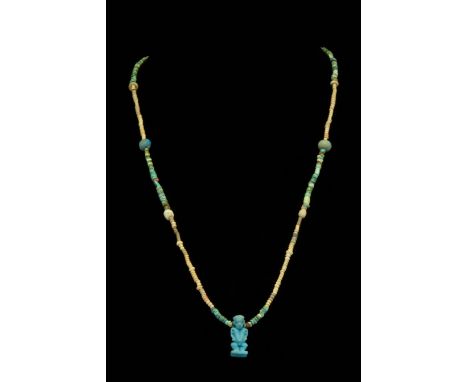Ca. 664 - 332 B.C. Late Dynastic Period. Egypt. An Ancient Egyptian re-strung necklace made of faience in yellow, green, blue