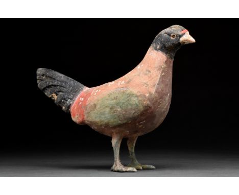 Ca. 206 BC–220 AD. Han dynasty. A beautiful terracotta bird with a light red body, black head and tail, green wings and legs.