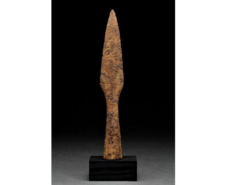 Ca. 300–500 AD Roman. A spearhead comprising a slender tapering leaf-shaped blade with a narrow neck and conical socket for i