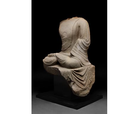 Ca. 618–907 AD. Chinese Tang Dynasty. A beautiful marble statue of a seated bodhisattva depicted wearing voluminous robes ele