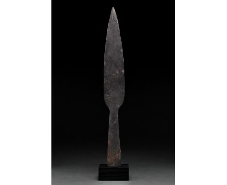 Ca. 100–300 AD. Roman. An iron spearhead with an elongated leaf-shaped blade, sharp tapering edges, and a long flared socket.