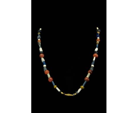 Ca. 100–300 AD. Roman. A beautiful restrung and fully wearable necklace made of a single string of white and blue glass and c