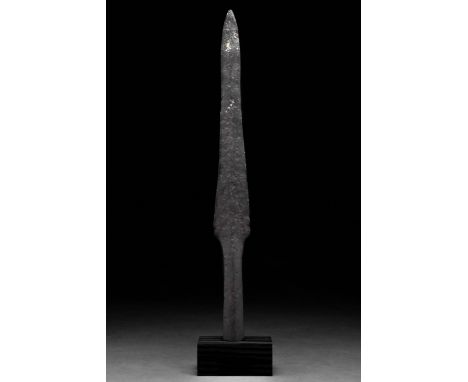 Ca. 1000–1200 AD. Viking Age. An iron spearhead with a leaf-shaped blade, sharp edges flaring slightly before tapering to a p