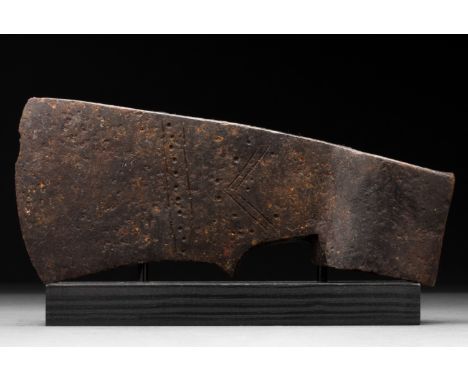 Ca. 900–1100 AD. Viking Age. An iron bearded axe head with a curved blade, a reinforced square poll and a long cheek decorate