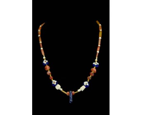 Ca. 100–300 AD. Roman. A beautiful restrung and fully wearable necklace comprising an upper registry of tubular carnelian sto