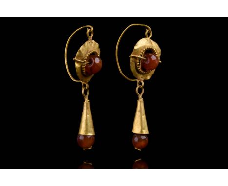 Ca. 100–300 AD. Roman. A matched pair of gold earrings, each with an open dome, the inner border with a fringe of granulated 