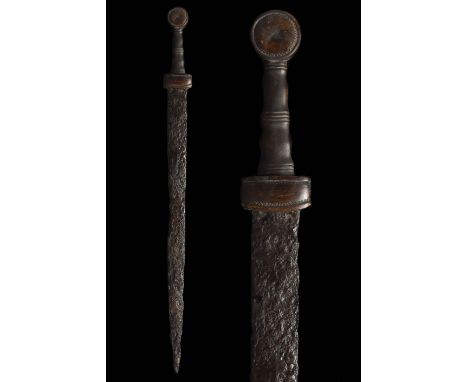 Ca. 200–400 AD. Roman. An iron spatha with a long tapering, bevelled blade, and a reconstructed bone hilt with a circular pom