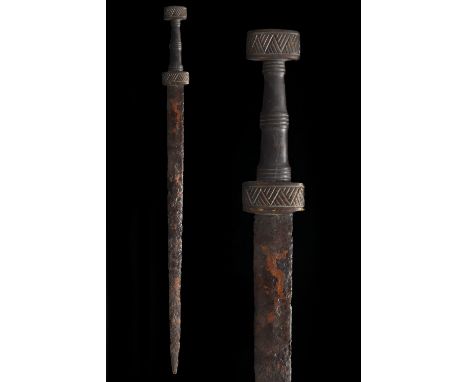 Ca. 200–400 AD. Roman. An iron spatha with a long tapering, bevelled blade, and a reconstructed bone hilt with a flat circula