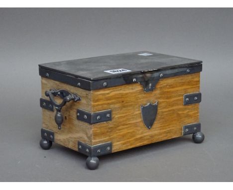 A mid-20th century silver plated oak mounted rectangular tea caddy, with twin lidded interior, 21cm wide x 12cm high.