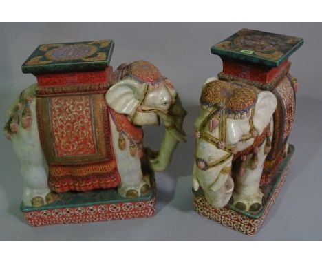 A pair of 20th century ceramic garden seats formed as elephants, 55cm high (2).