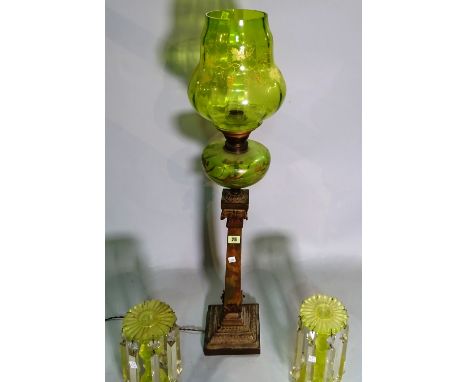 A late Victorian oil lamp converted to a table lamp with amber glass shade and a pair of amber coloured glass candlesticks, (