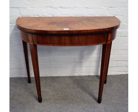 A George III kingwood banded mahogany semi-elliptic card table, on tapering square supports, 91cm wide x 75cm high.