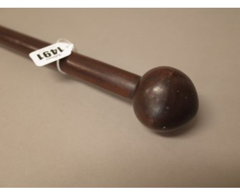 A South African hardwood long stick, with spherical pommel over a cylindrical shaft, 148cm.