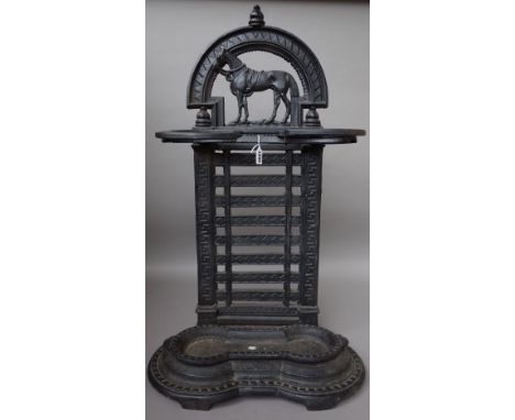 A cast iron stick stand, circa 1900, 'The Favourite', with horse surmount over title and horseshoe guards, with a ladder back