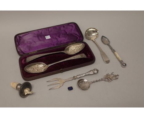 A pair of silver serving spoons, with later floral and foliate embossed decoration, London 1806, with a fitted case, a Scotti