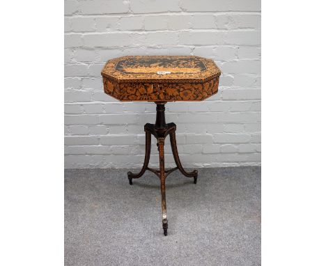 A Regency lift top penwork decorated occasional table, of compressed octagonal form on open tripod base, 48cm wide x 81cm hig