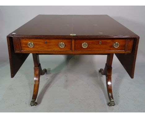 A Regency style mahogany sofa table on dual ended supports, 79cm wide x 71cm high. 