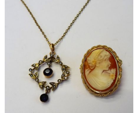 A gold, amethyst and seed pearl set pendant, designed as a wreath, with a neckchain, on a snap clasp, detailed R G and a 9ct 