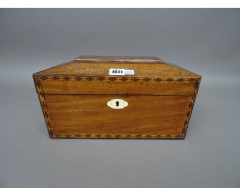 A Regency inlaid mahogany sarcophagus shape tea caddy with twin lidded interior, 33cm wide x 18cm high. 